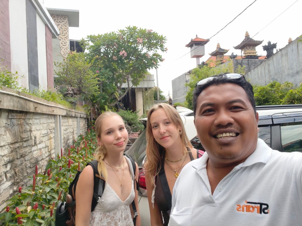 Happy travelers arriving at Bali destination with Wayan